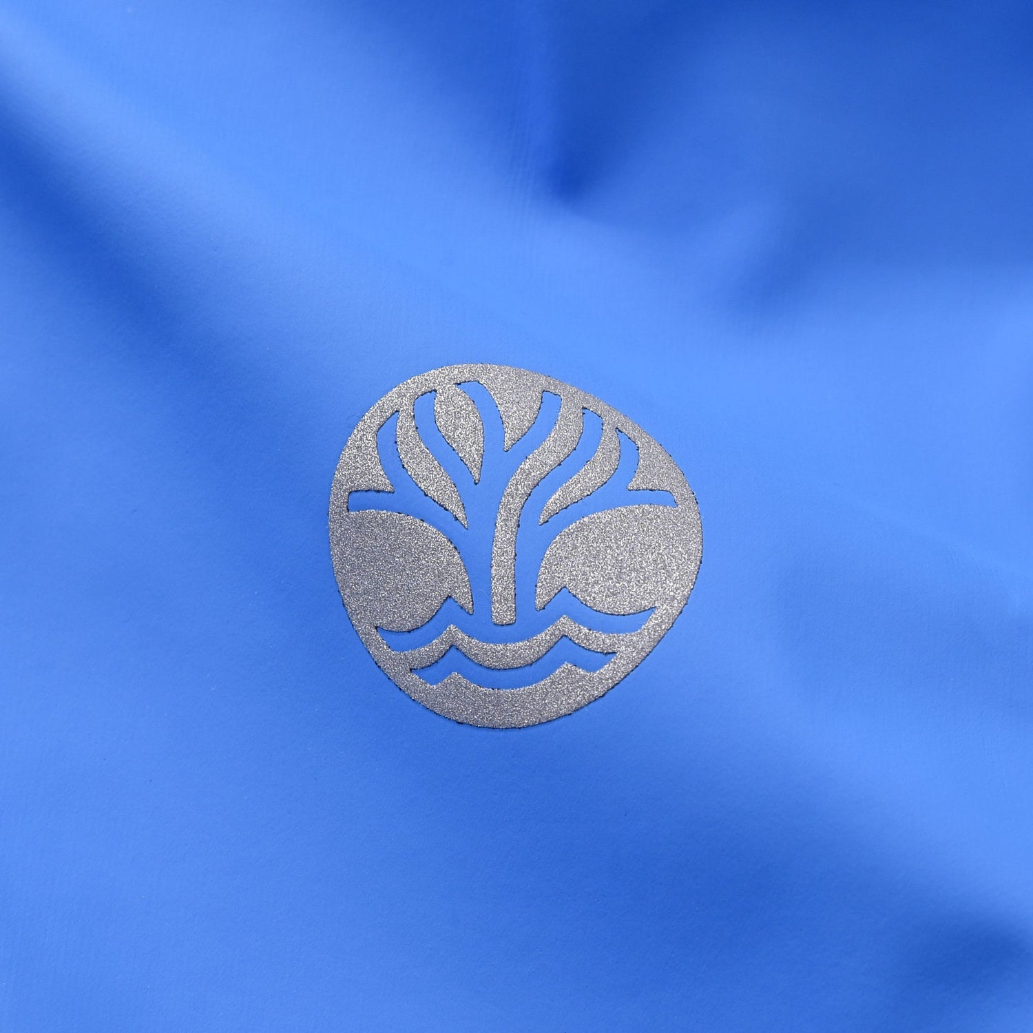 Reflective Wavetree logo on blue raincoat